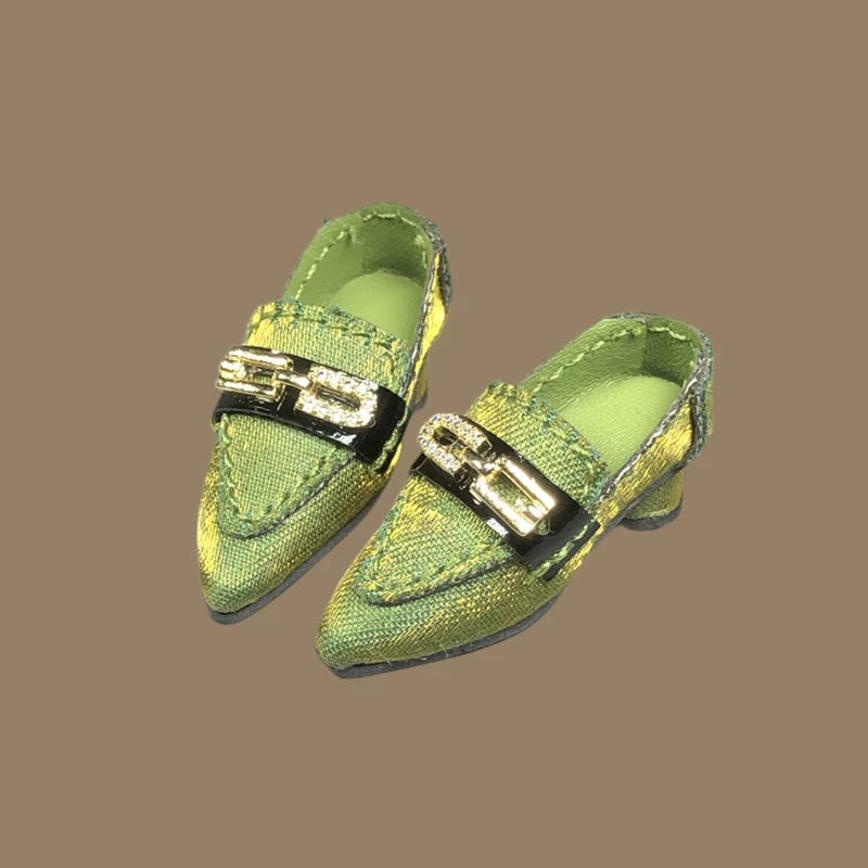 Green low-heel doll pumps with metal chain detail and glossy nylon finish