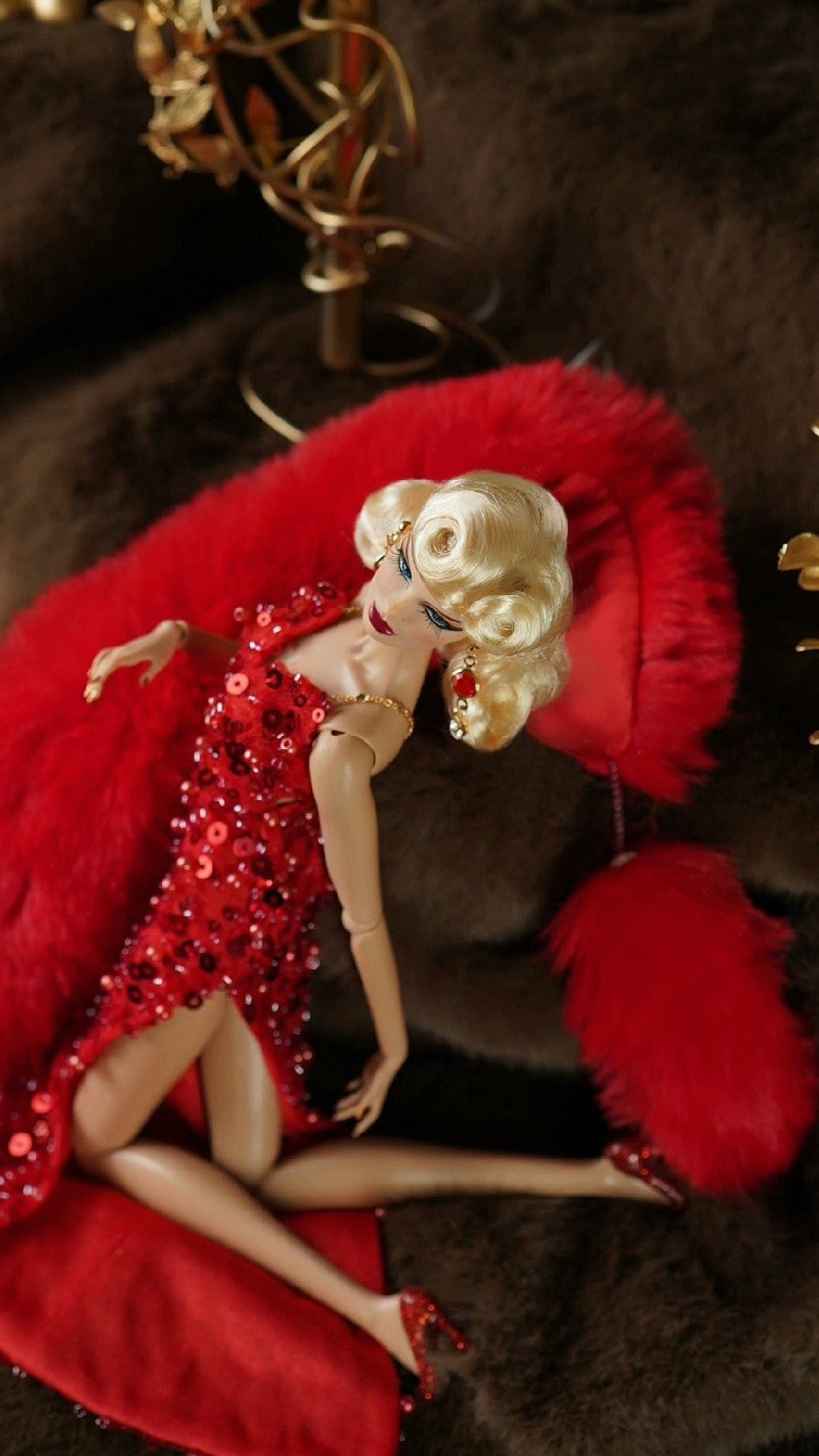 Fashion doll in a red evening dress styled with a red faux fur stole