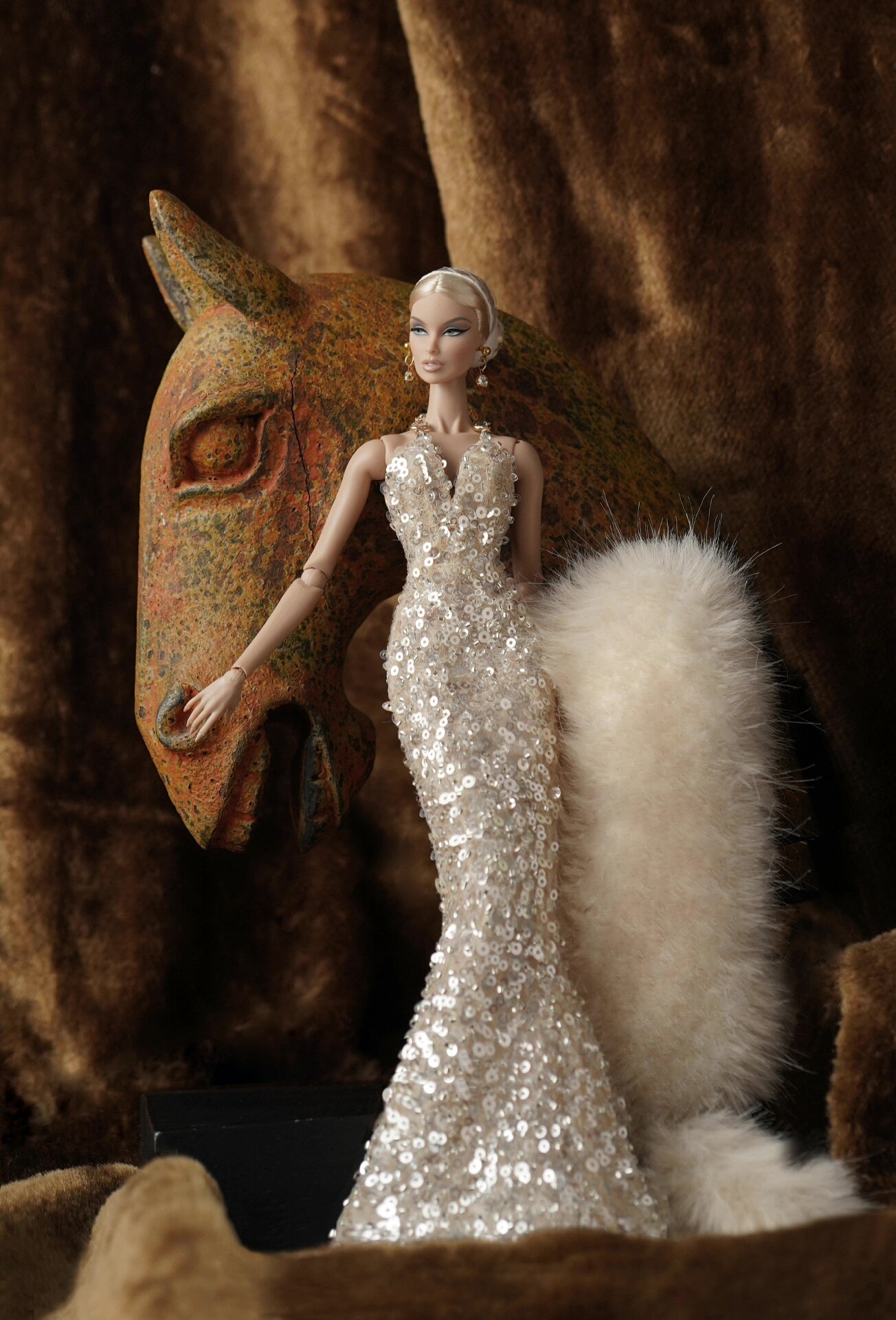 Detail of the soft beige faux fur and white satin lining on a 1/6 doll stole