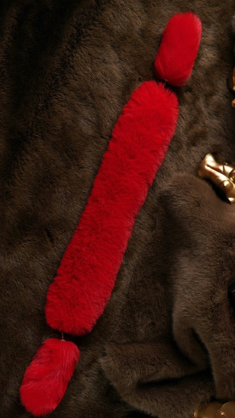 Close-up of black faux fur stole and rhinestone clasp for a 1/6 fashion doll
