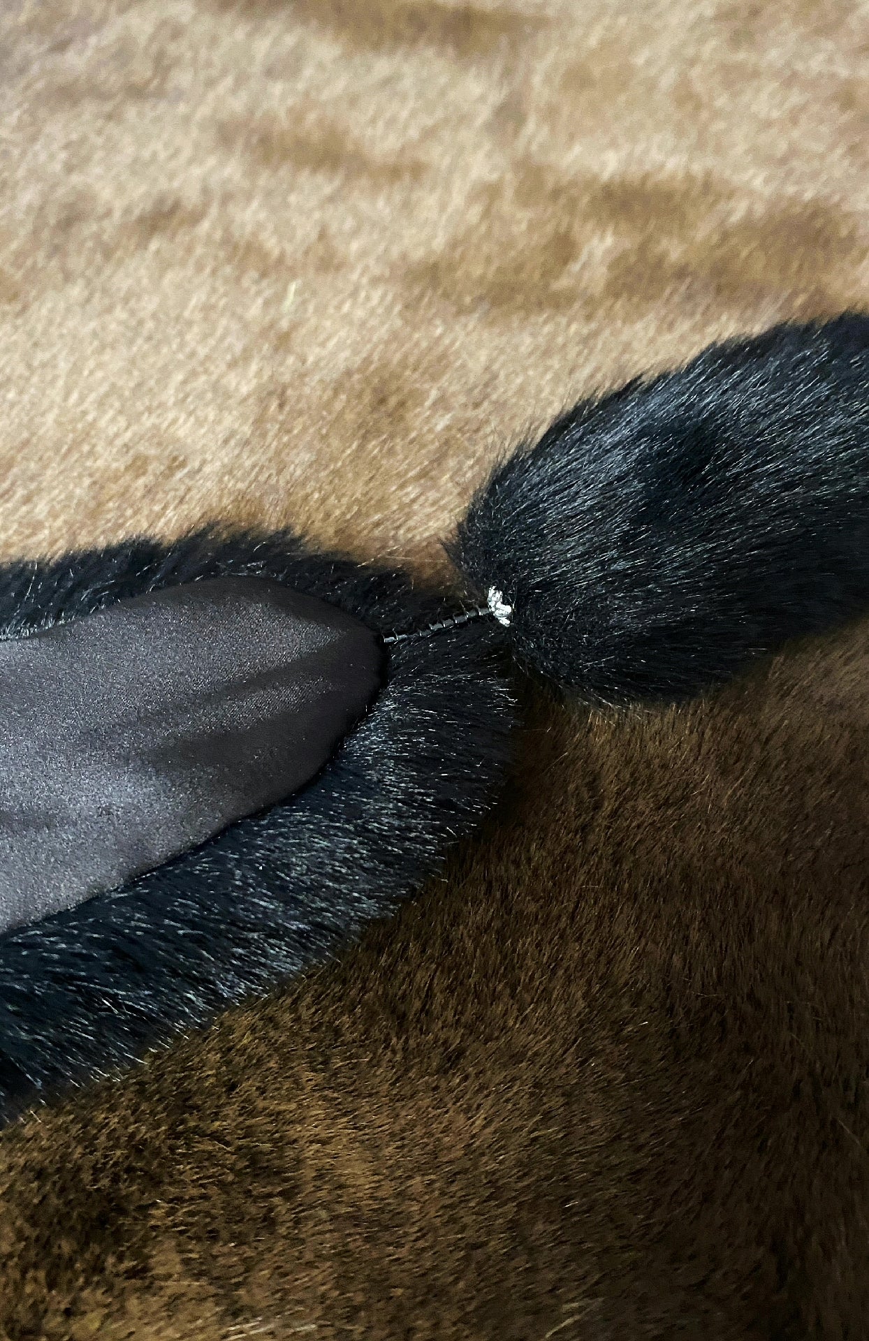 Black faux fur stole for 1/6 scale dolls shown flat with a rhinestone clasp