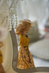 Side view of a vintage beige straw hat designed for 1/6 scale fashion dolls