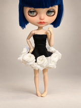 Blythe doll wearing a handmade Black Swan dress with a black strapless bodice and white rose tutu skirt on a luxury studio background