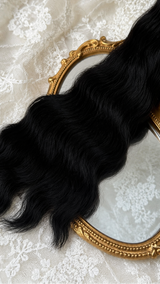Black natural mohair doll hair, three-quarter view on ivory lace with a gold baroque mirror
