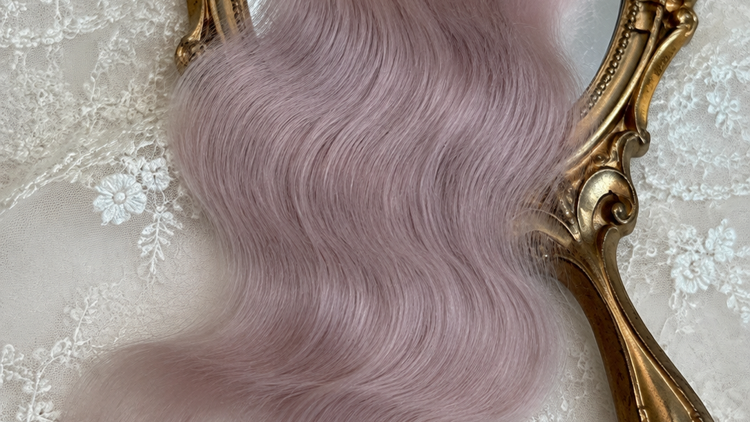 Dusty pink natural mohair doll hair, full overhead flat lay showing the complete fiber bundle