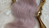 Dusty pink natural mohair doll hair, full overhead flat lay showing the complete fiber bundle