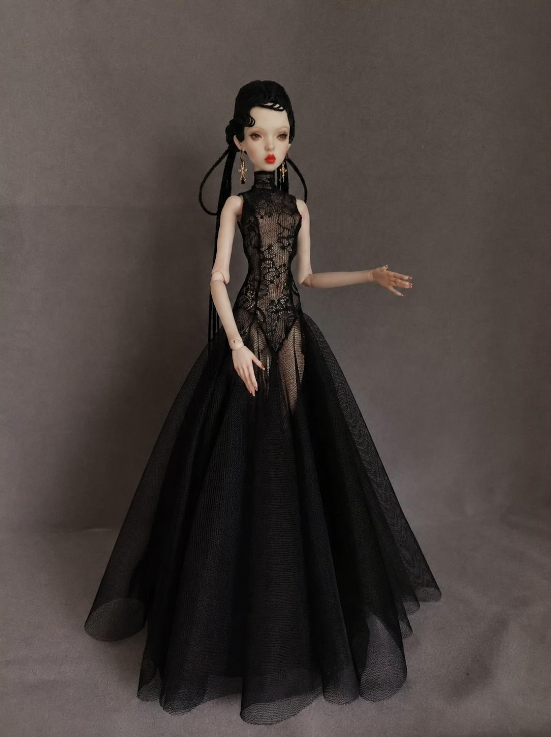 Dark romantic styling view of a black mermaid gown for a fashion doll.