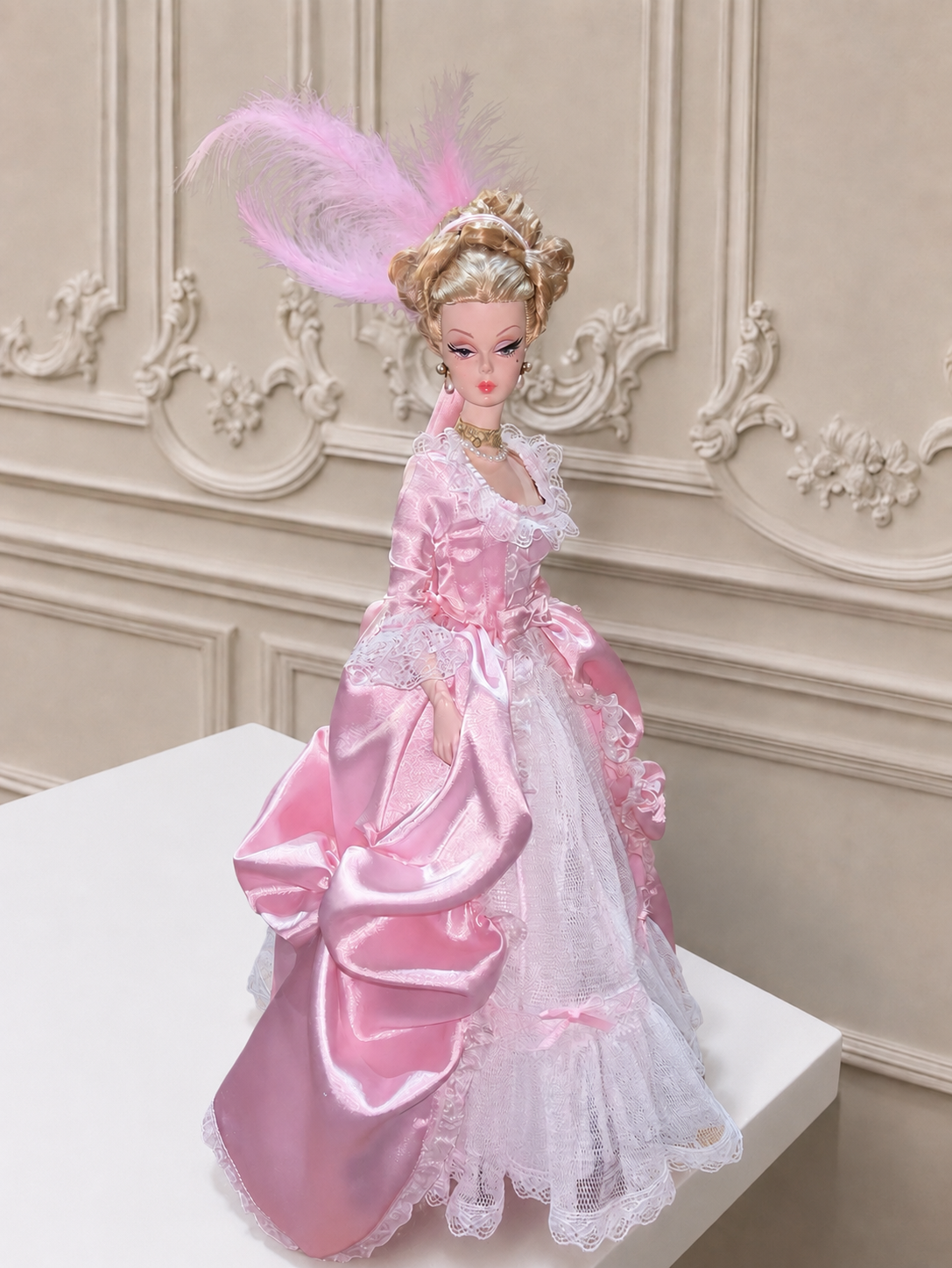 Pink 1/6 Rococo court dress on a fashion doll, front view against an ornate Rococo wall
