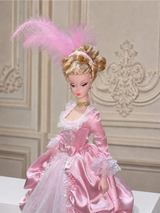 Close-up of pink 1/6 Rococo court dress with lace bodice and feather headpiece against Rococo wall