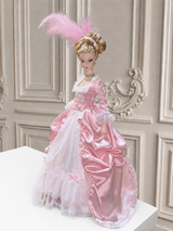 Full-length pink 1/6 Rococo court dress with layered skirt against an ornate French-style wall