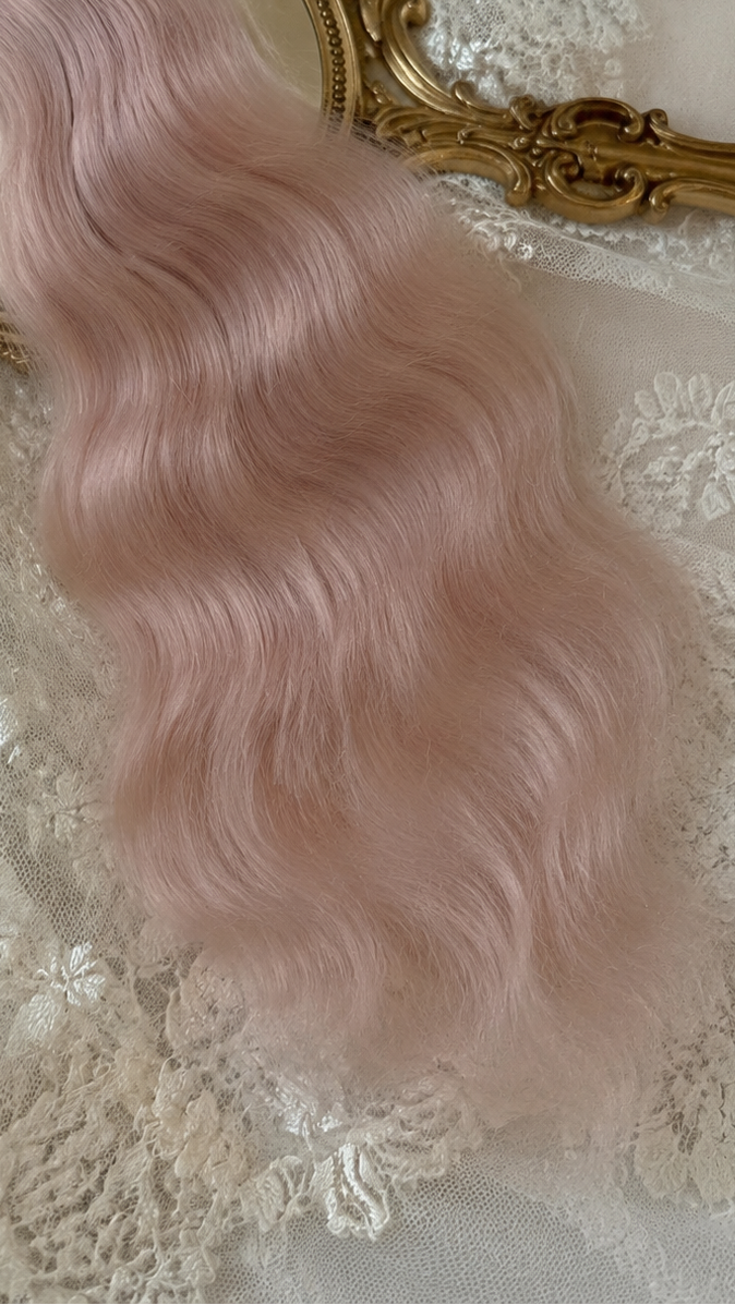Snow pink natural mohair doll hair, full overhead flat lay showing the complete fiber bundle